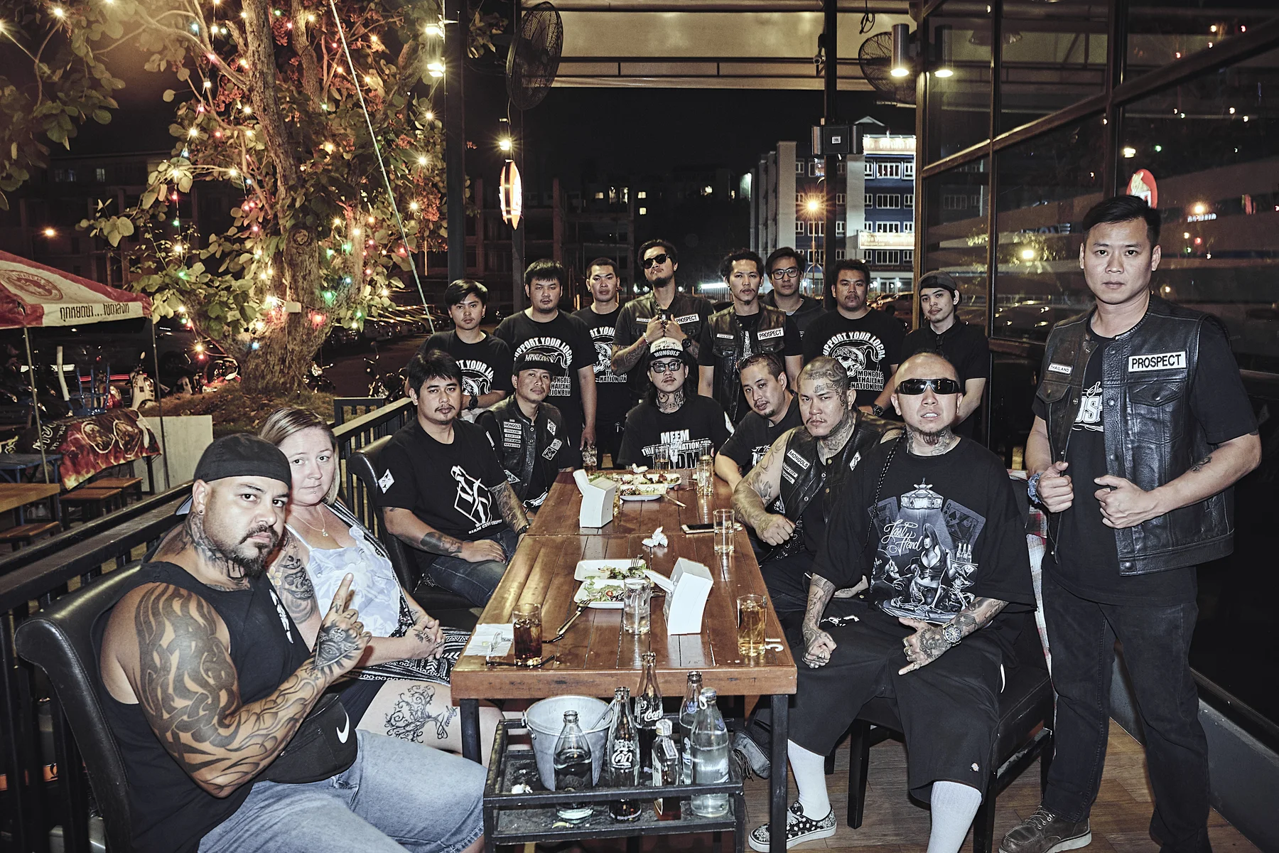 Large group of Asian Barrio friends gathered around one table