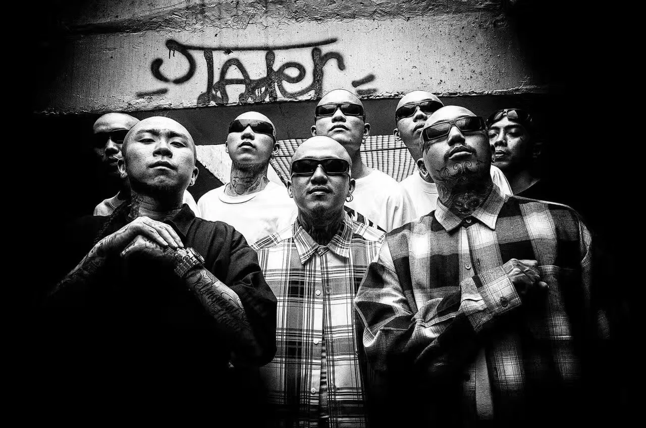 Asian Barrio brothers standing together for a black-and-white campaign portrait