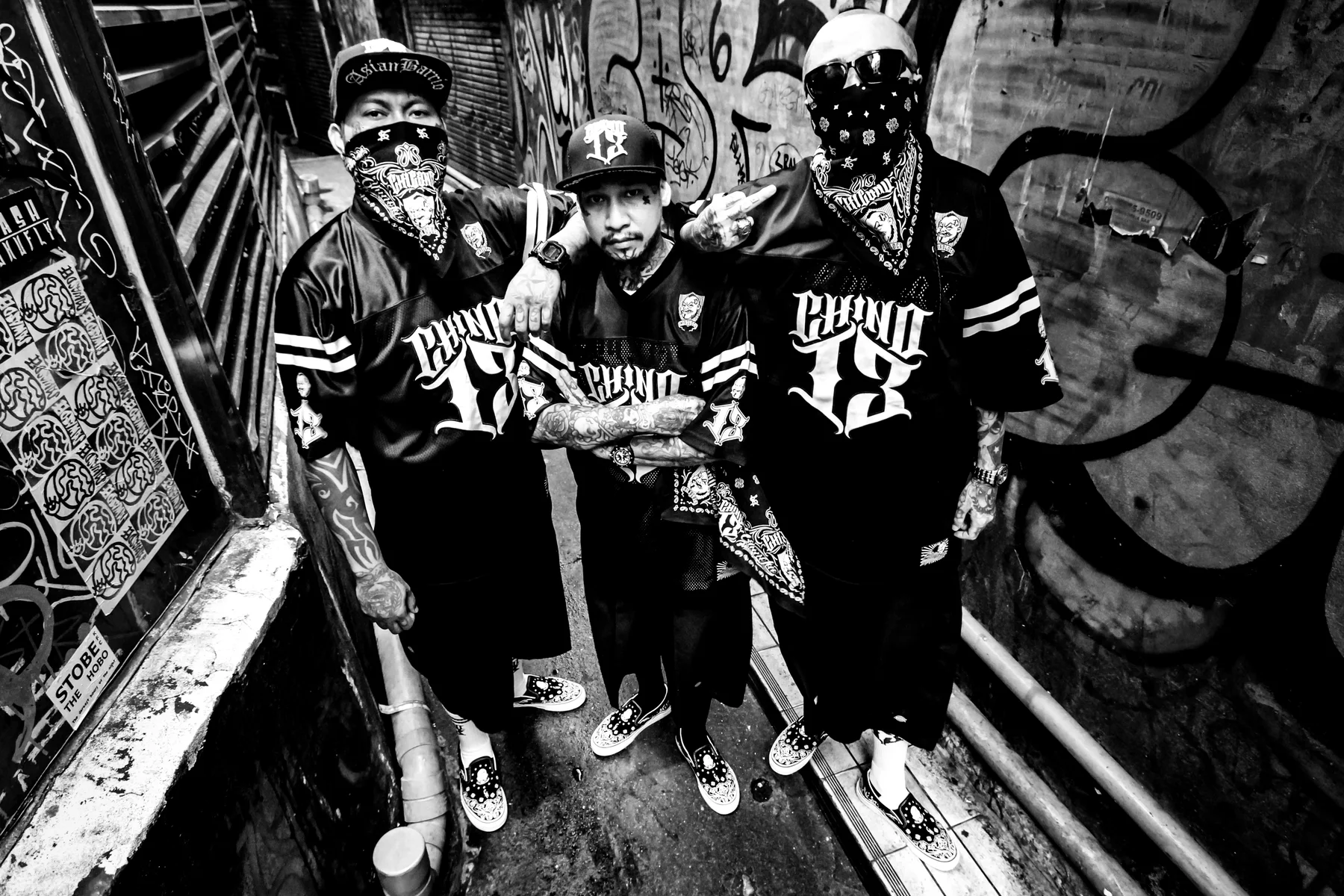 Asian Barrio crew posing together in a black-and-white campaign photograph