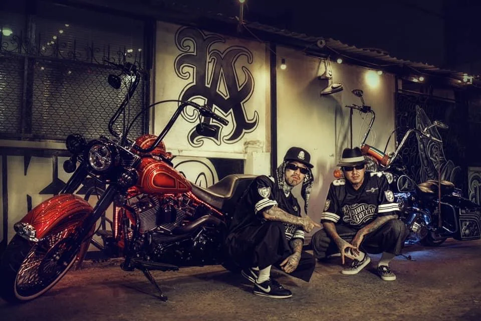 Asian Barrio crew posing with motorcycles at Liem Barber in Ho Chi Minh City