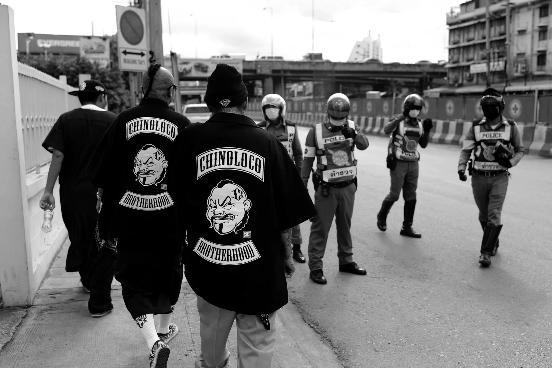 Asian Barrio crew walking together through the street